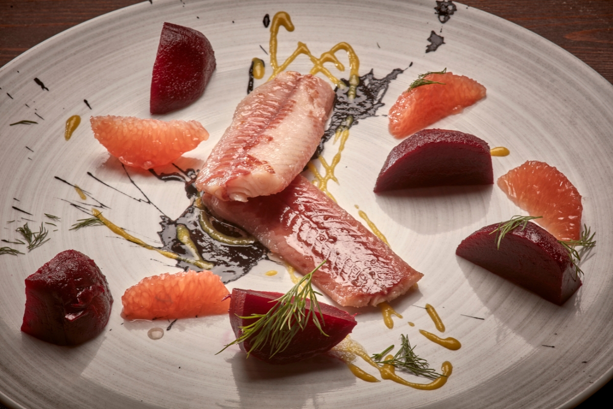 a plate of food on a wood table