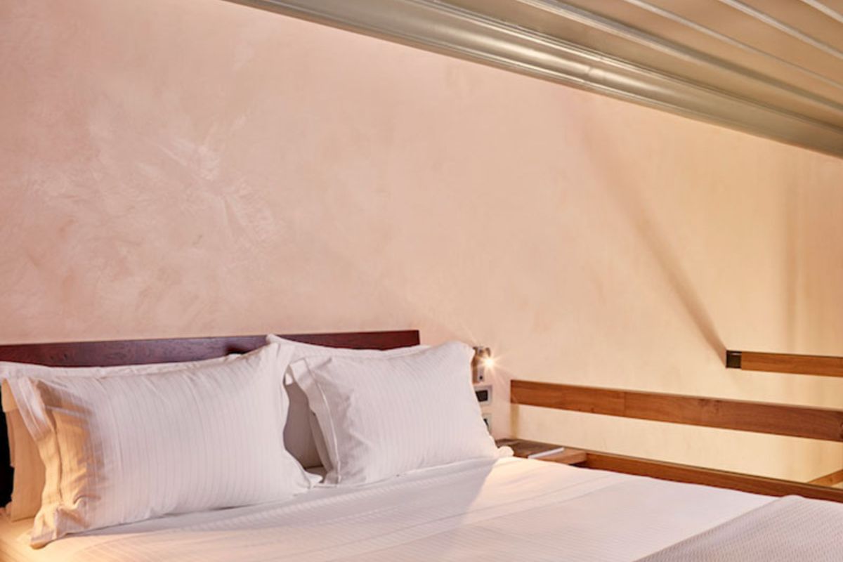 a bed with white pillows