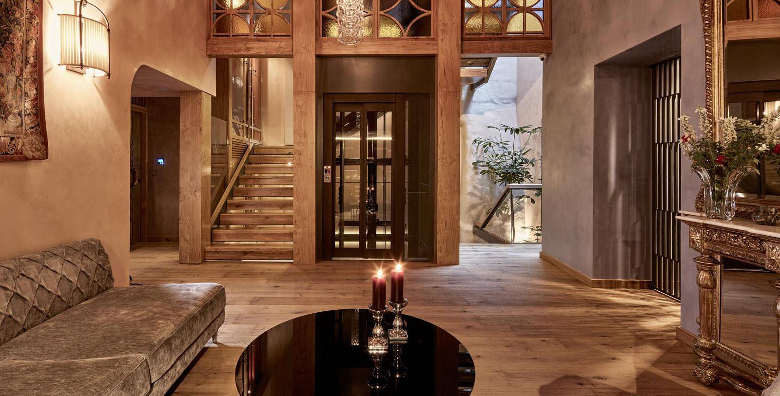 a room with a glass door and a staircase