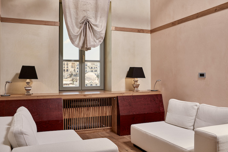 a room with a window and a couch