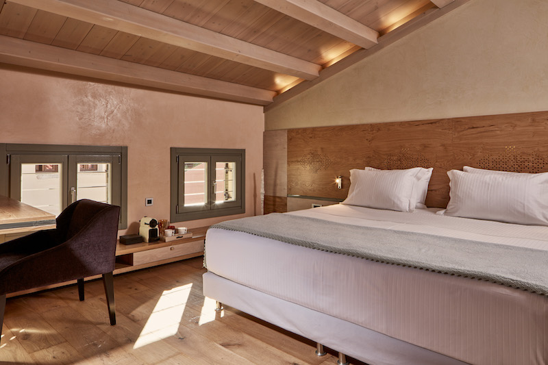 a room with a bed and a chair