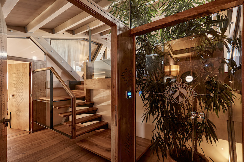 a glass door leading to a staircase