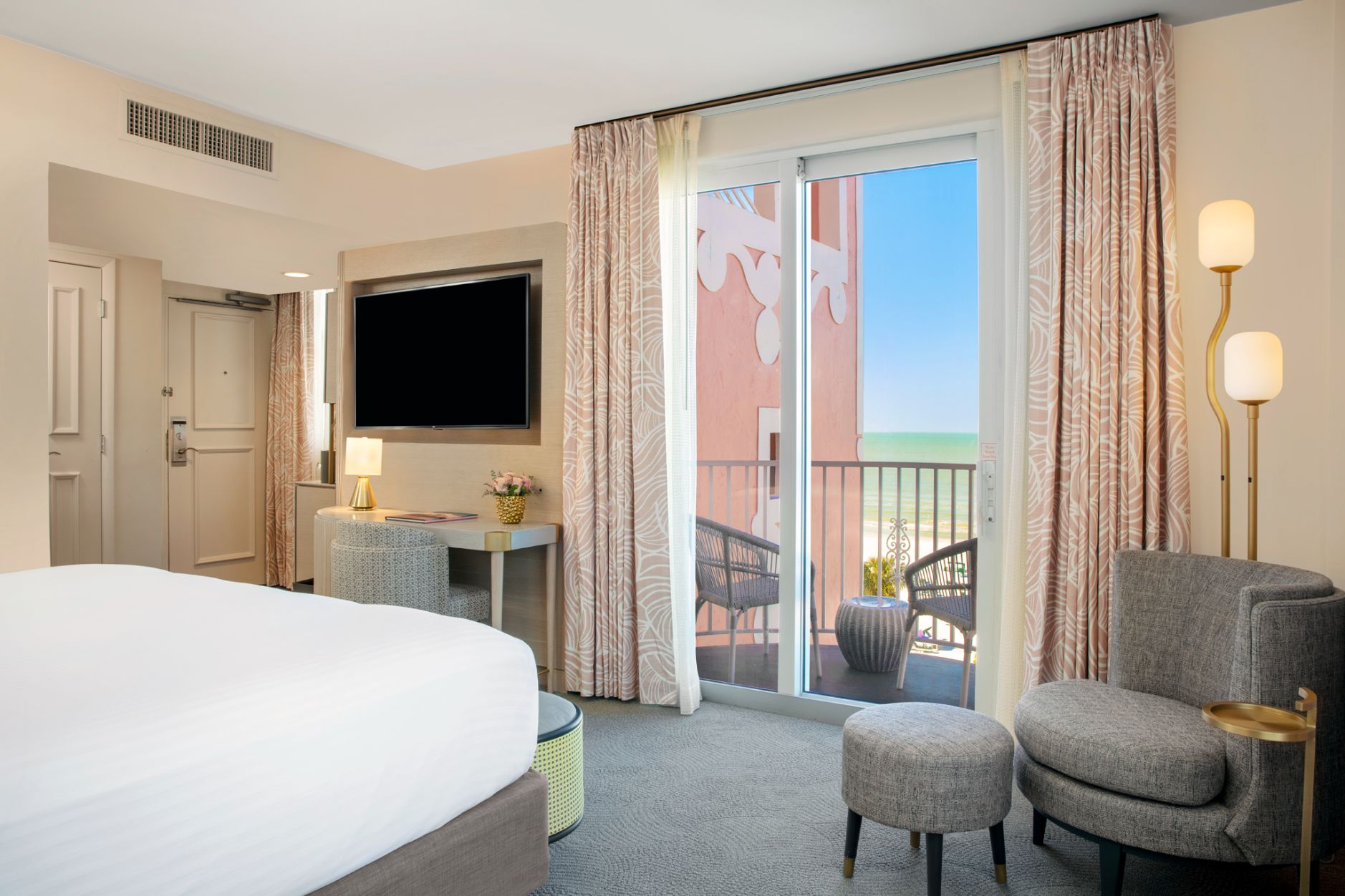 a room with a bed and a television