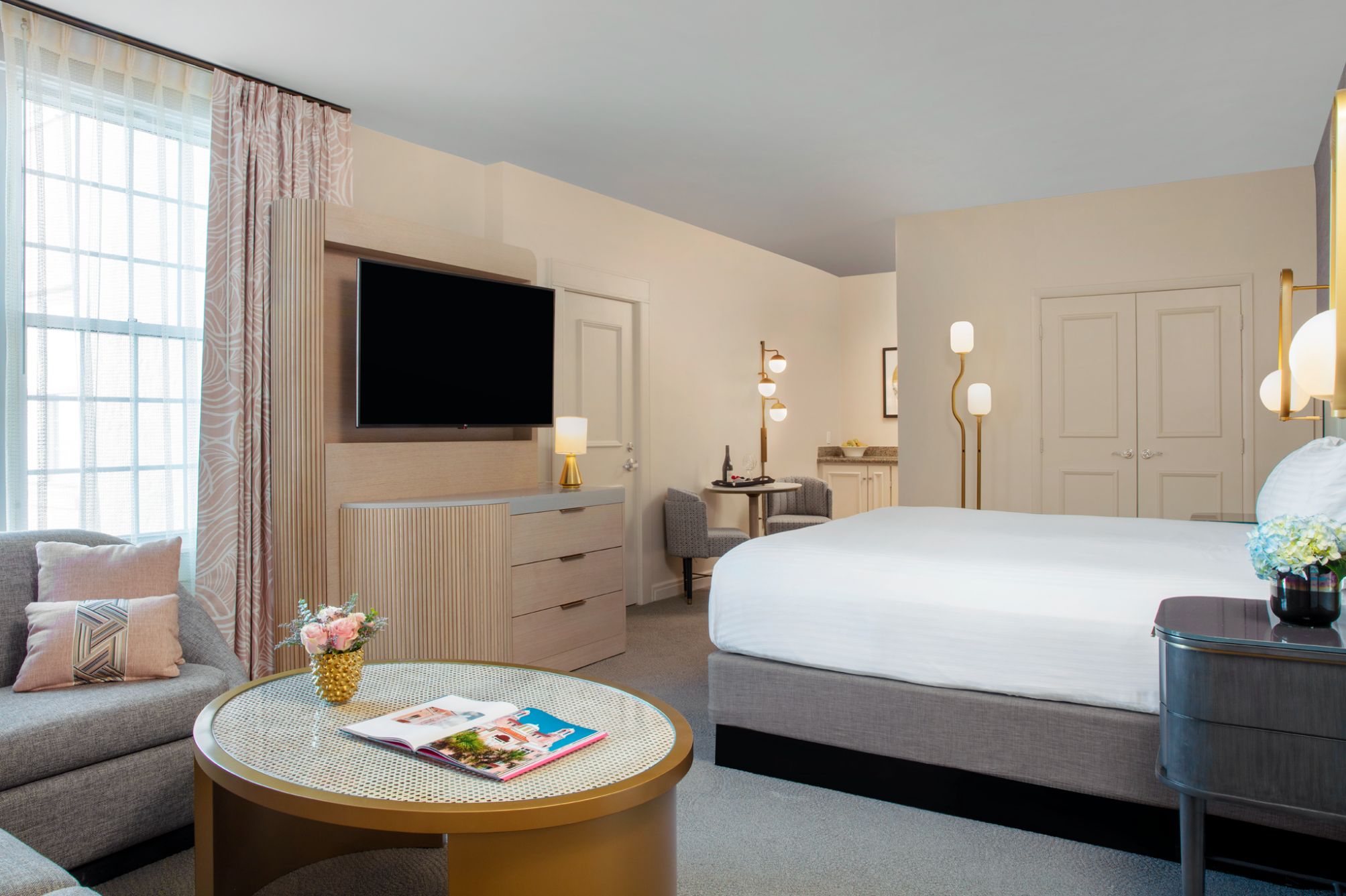 a room with a bed and a television