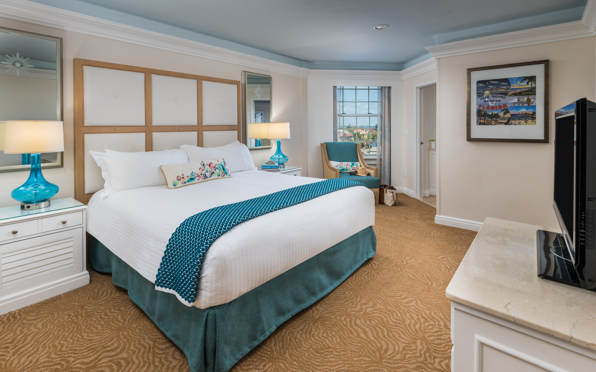 a room with a bed and a mirror