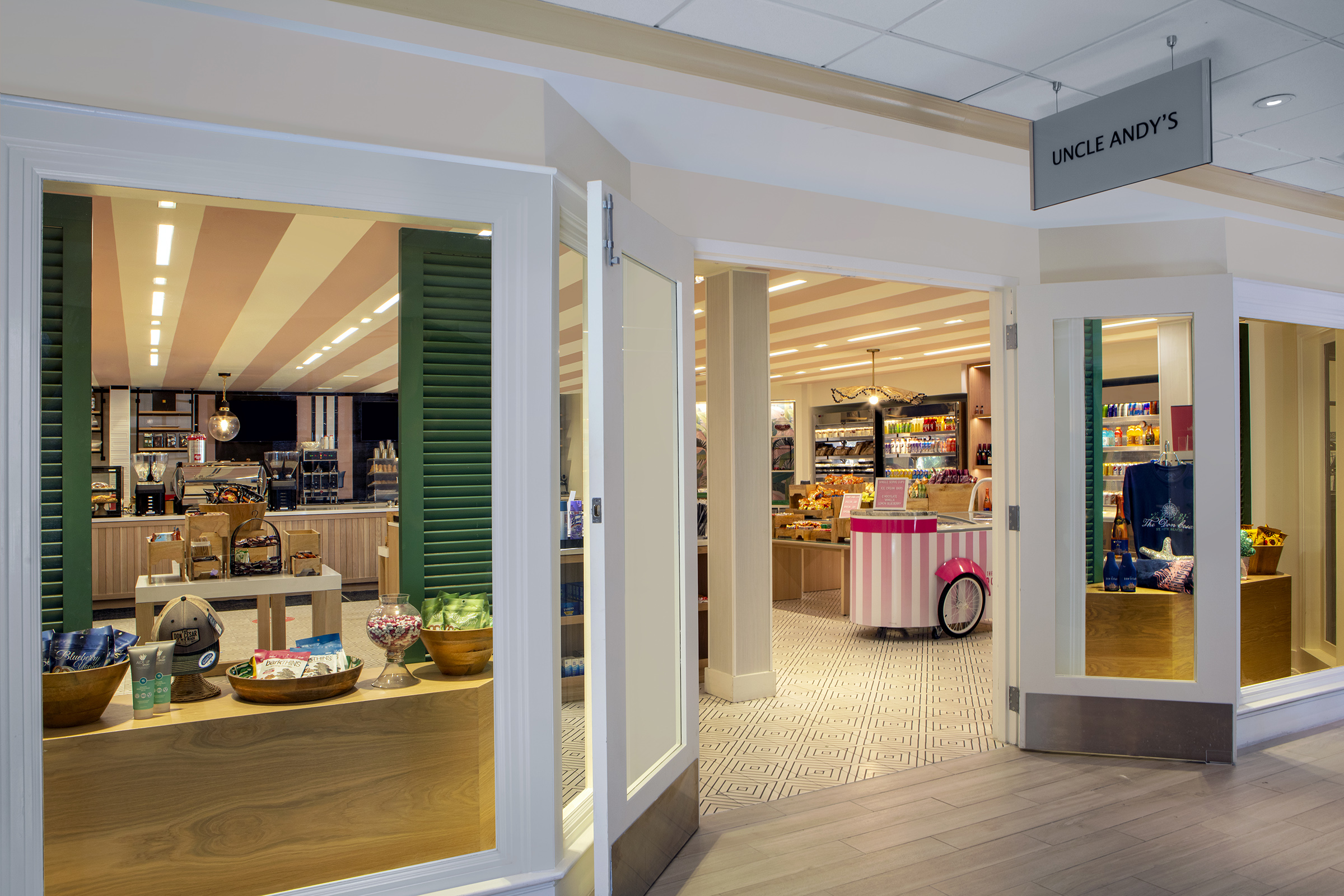 a store with a pink and white striped ceiling