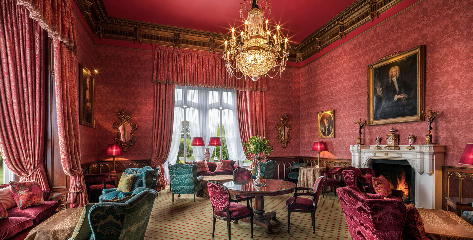 a room with a chandelier and chairs