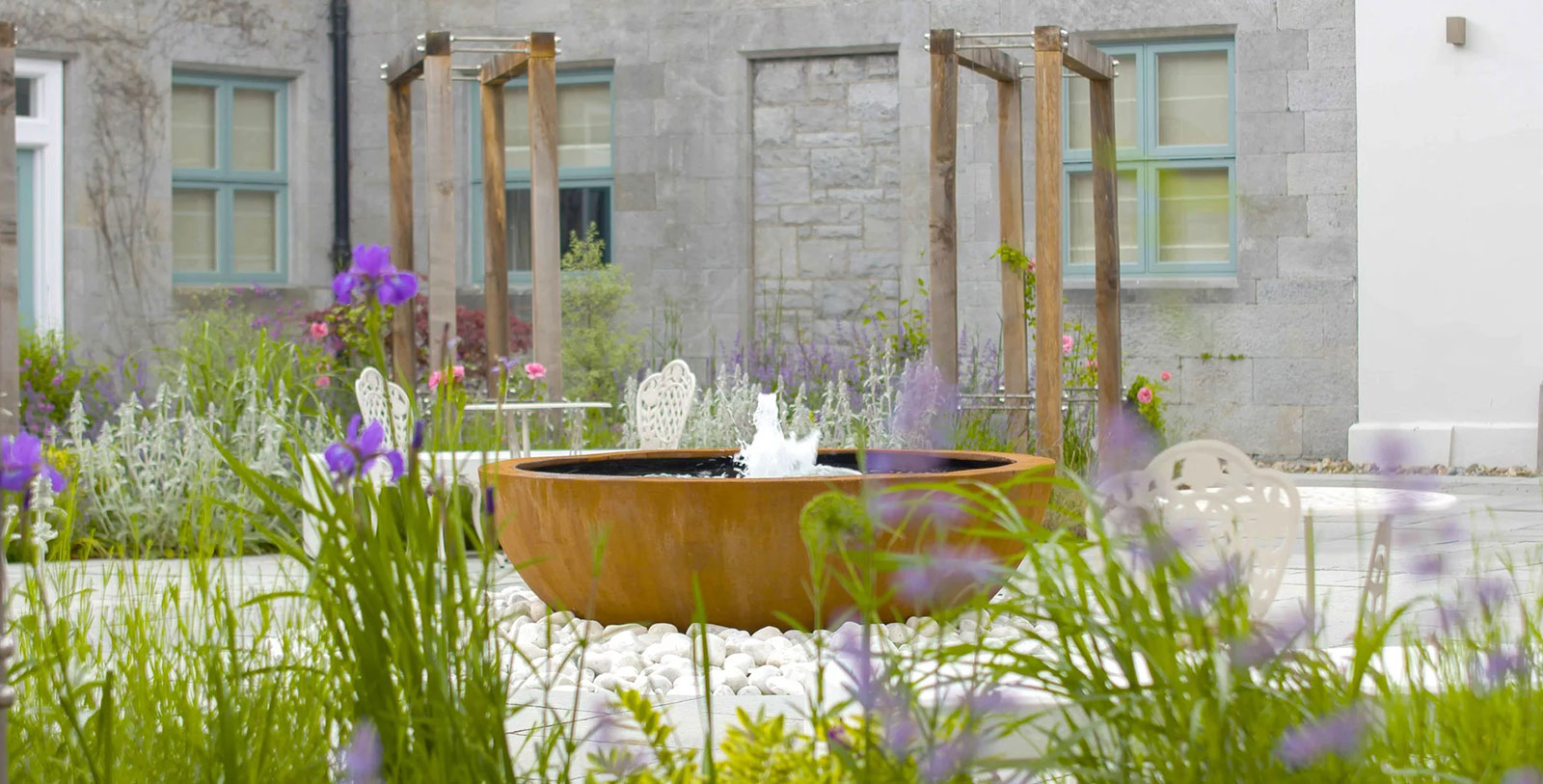 a water fountain in a garden