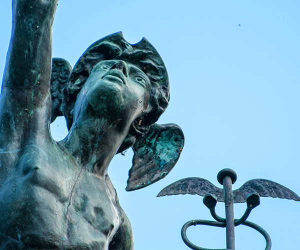 a statue of a man with wings