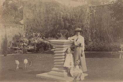 a woman and two children posing for a picture