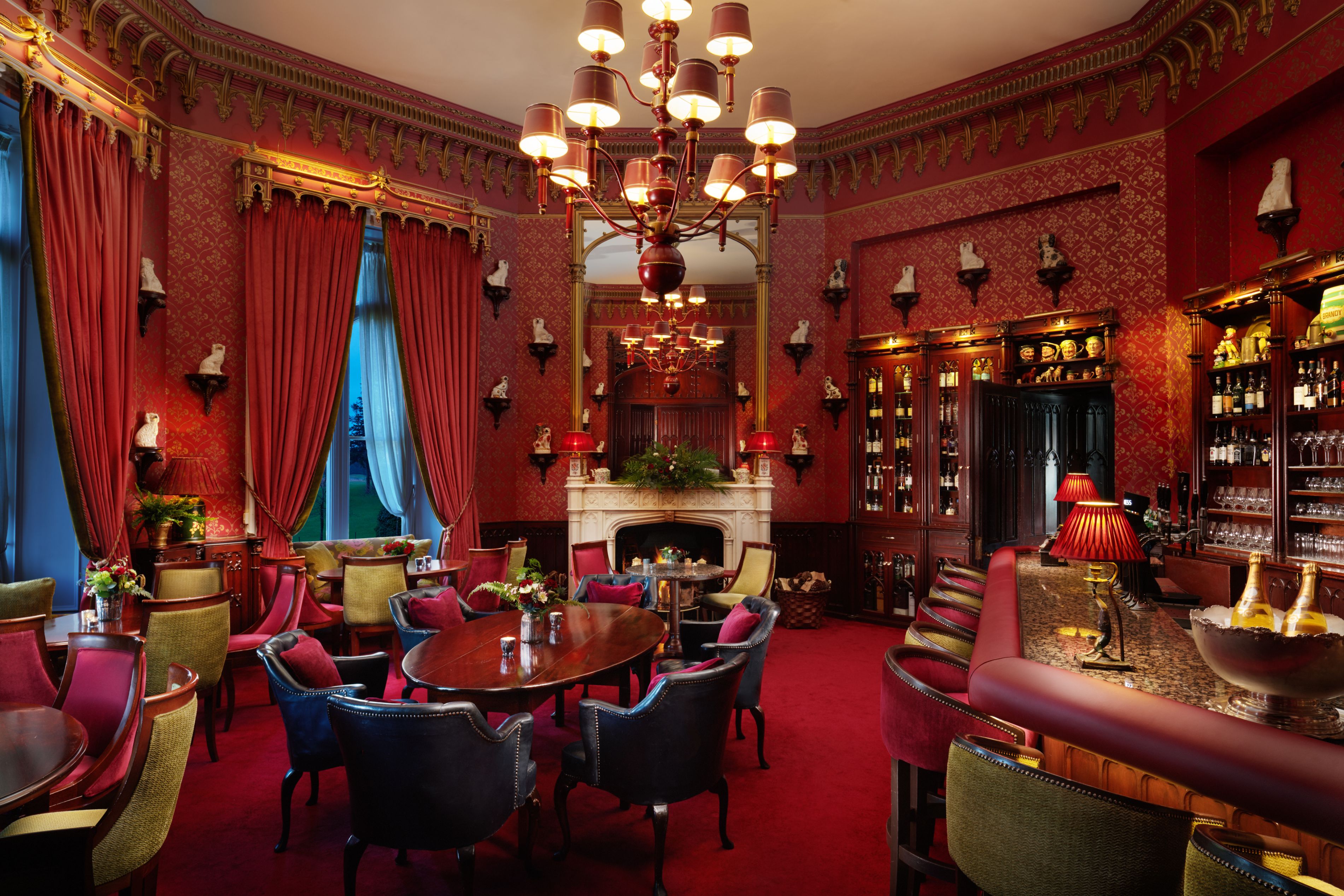 a room with a chandelier and tables