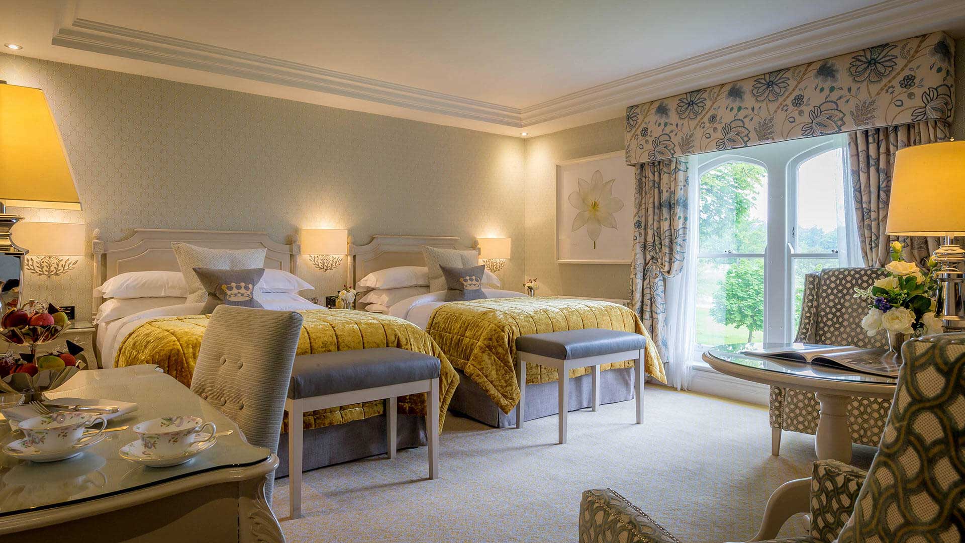 a room with two beds and a window