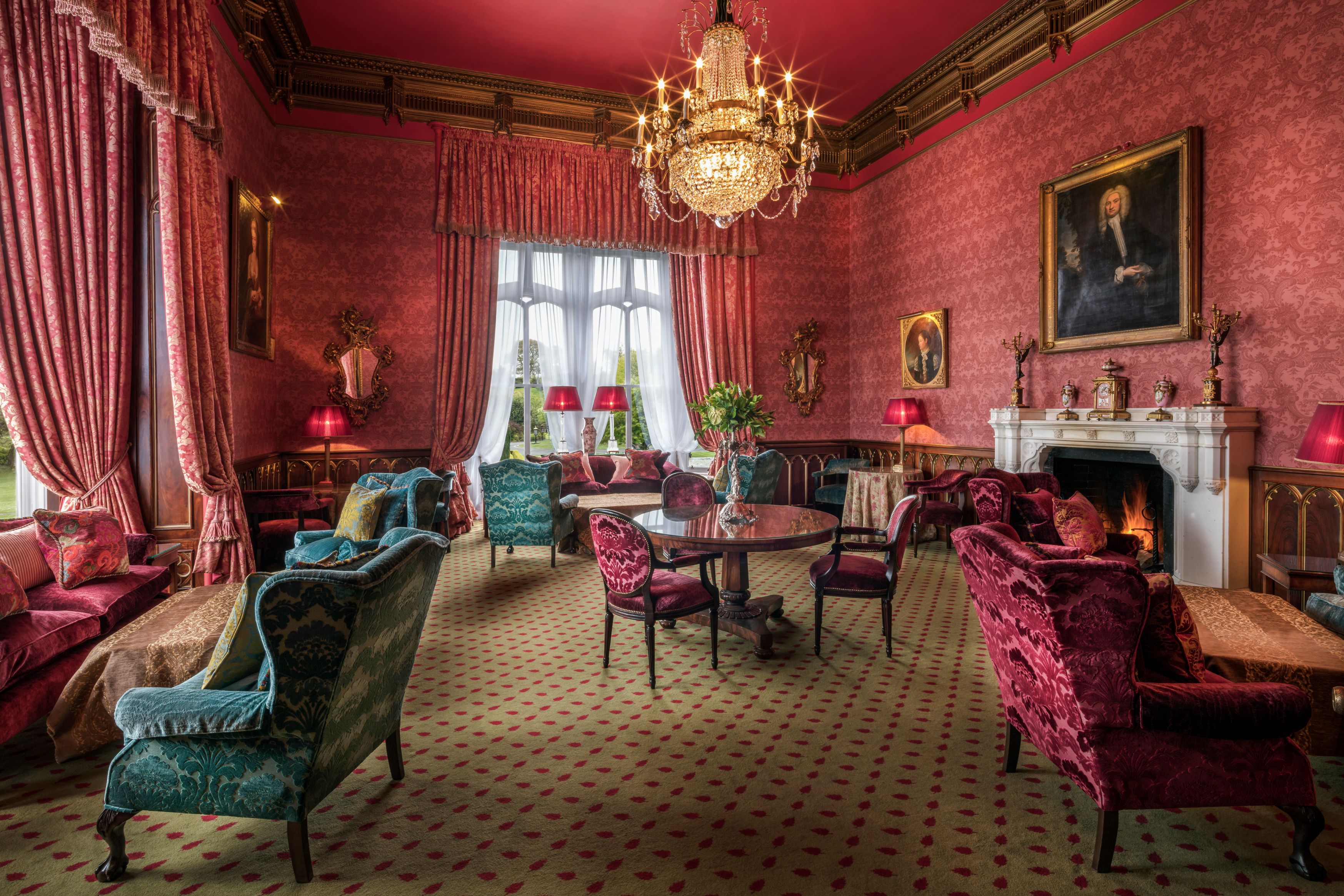 a room with a chandelier and chairs