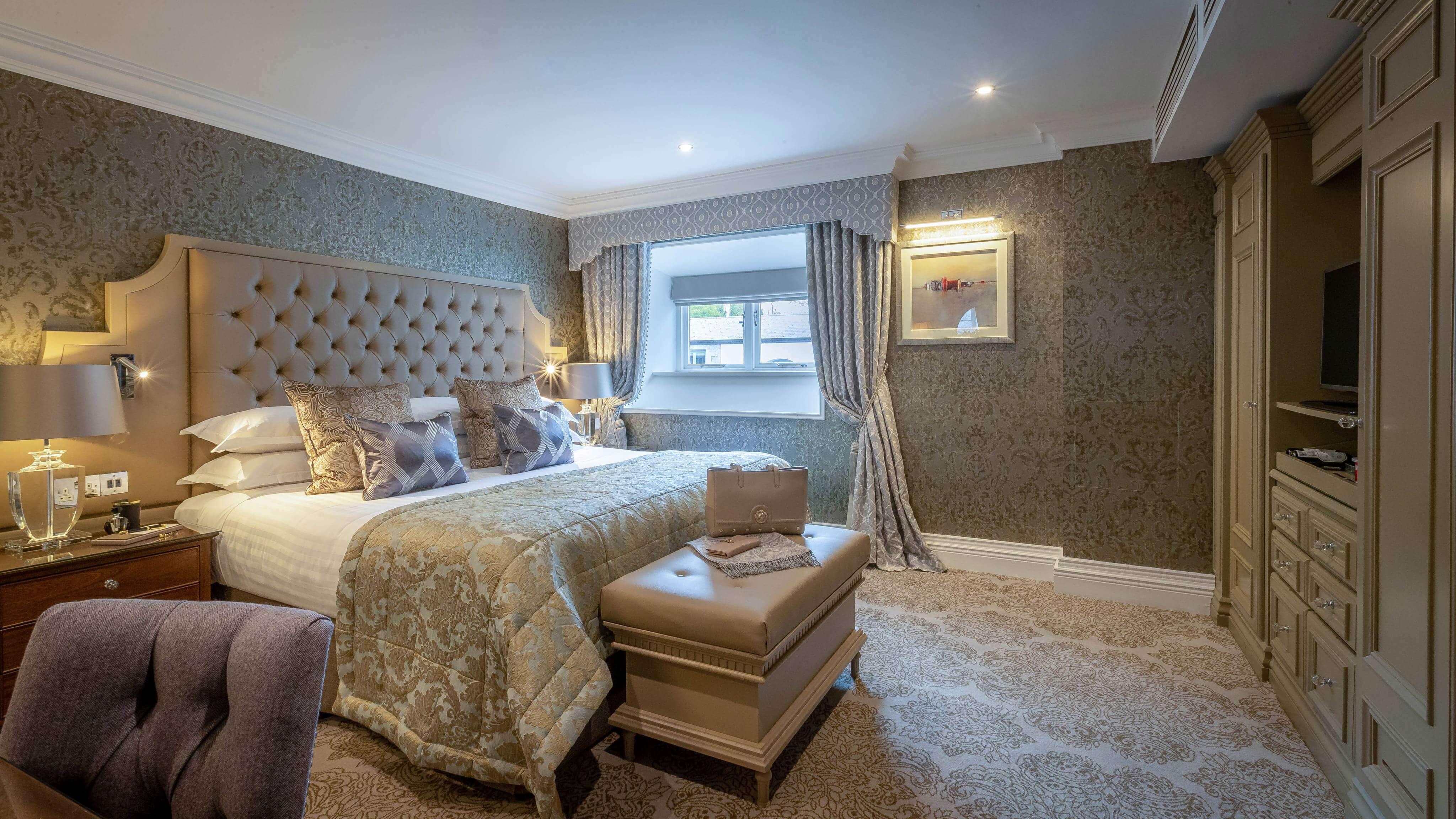 a bedroom with a bed and a mirror