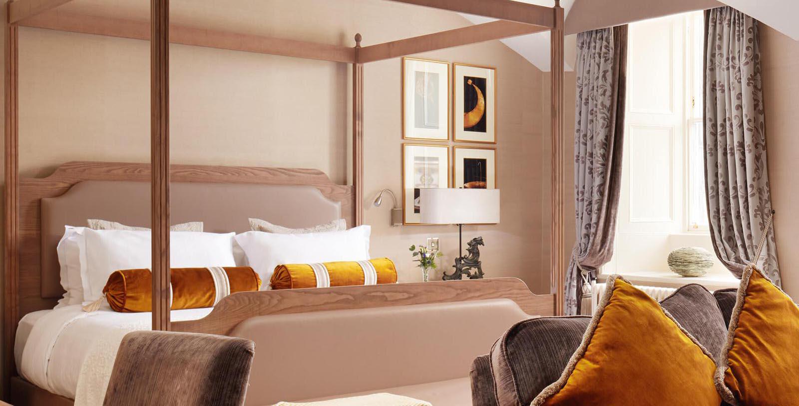 a room with a four poster bed