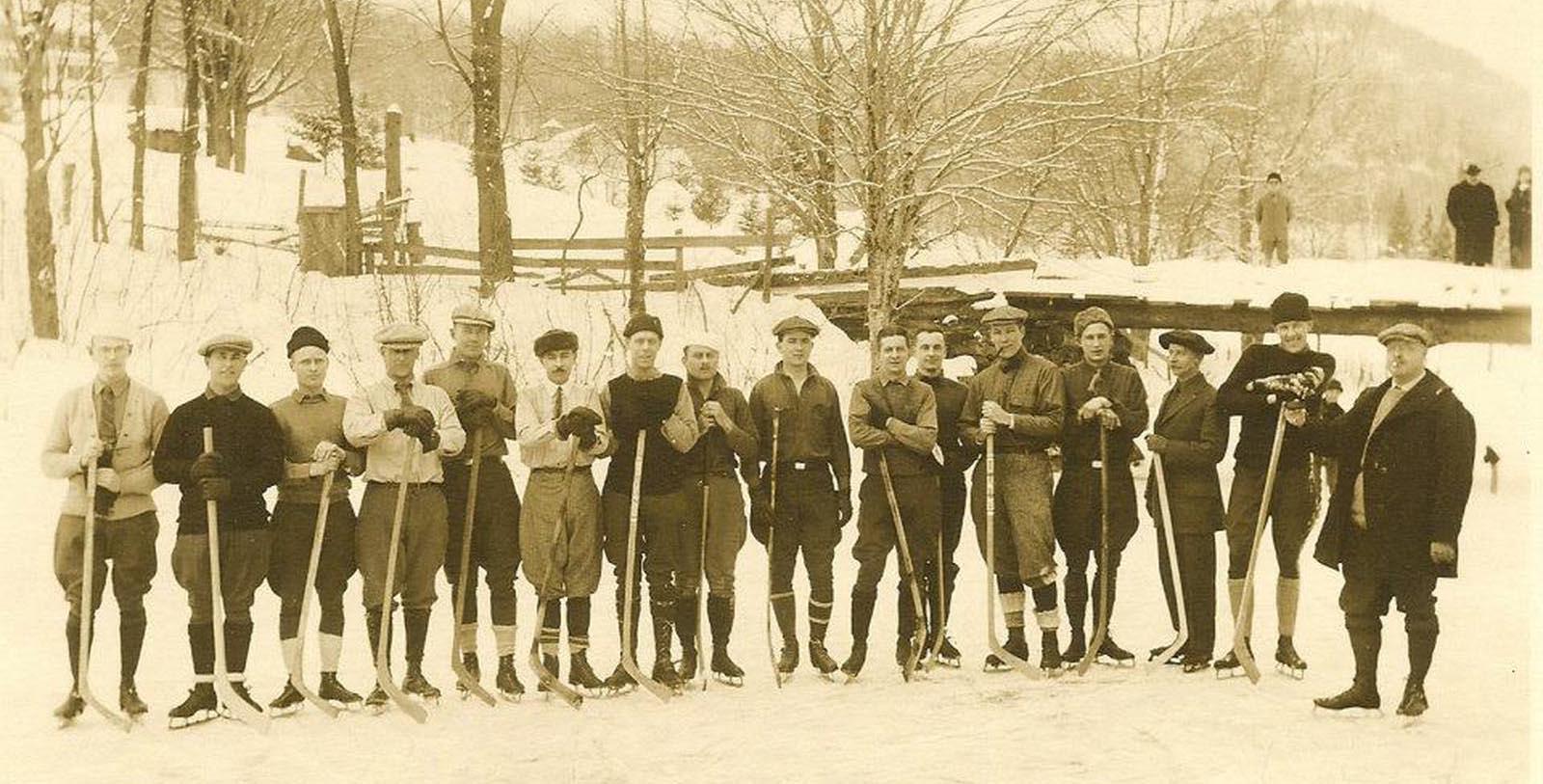 a group of men in skis posing for a photo