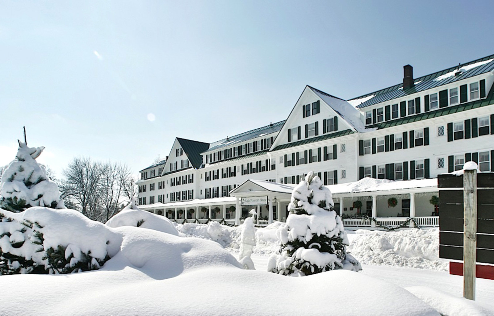 a large white building with snow on the ground