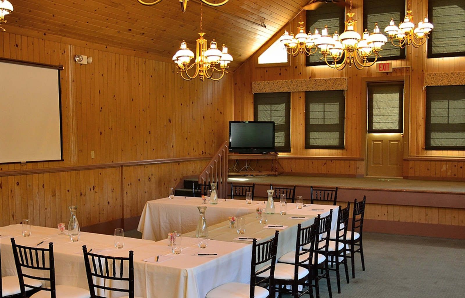 a room with a large table and chairs