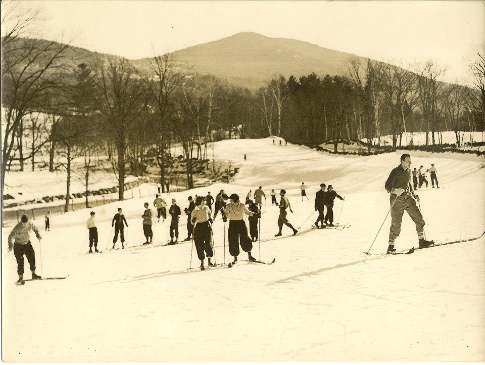 a group of people skiing on the snow