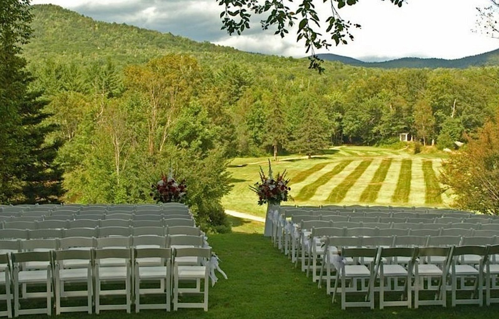 a wedding ceremony with rows of chairs