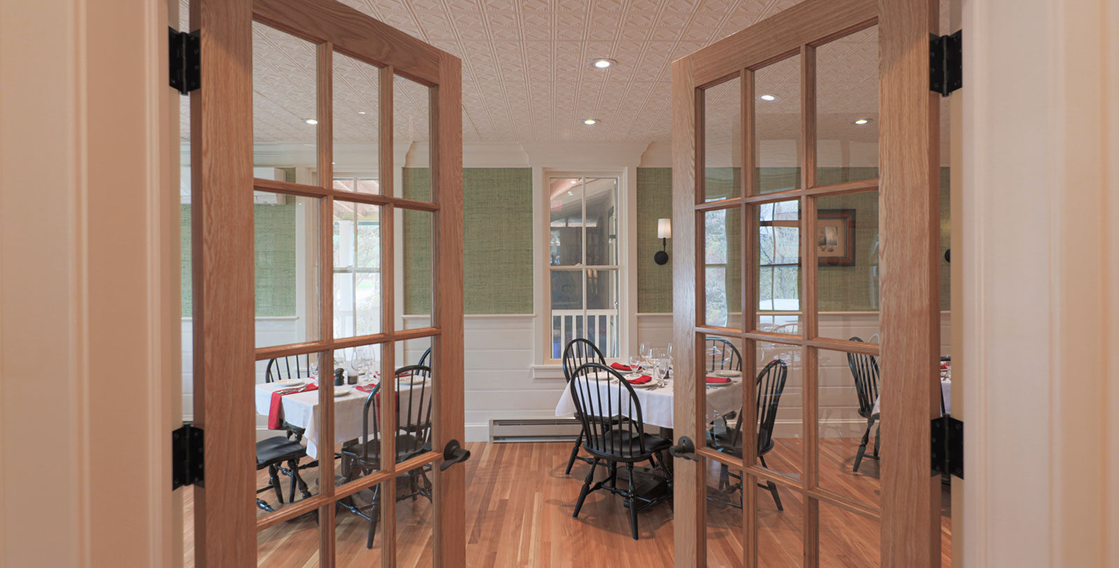 a dining room with a table and chairs