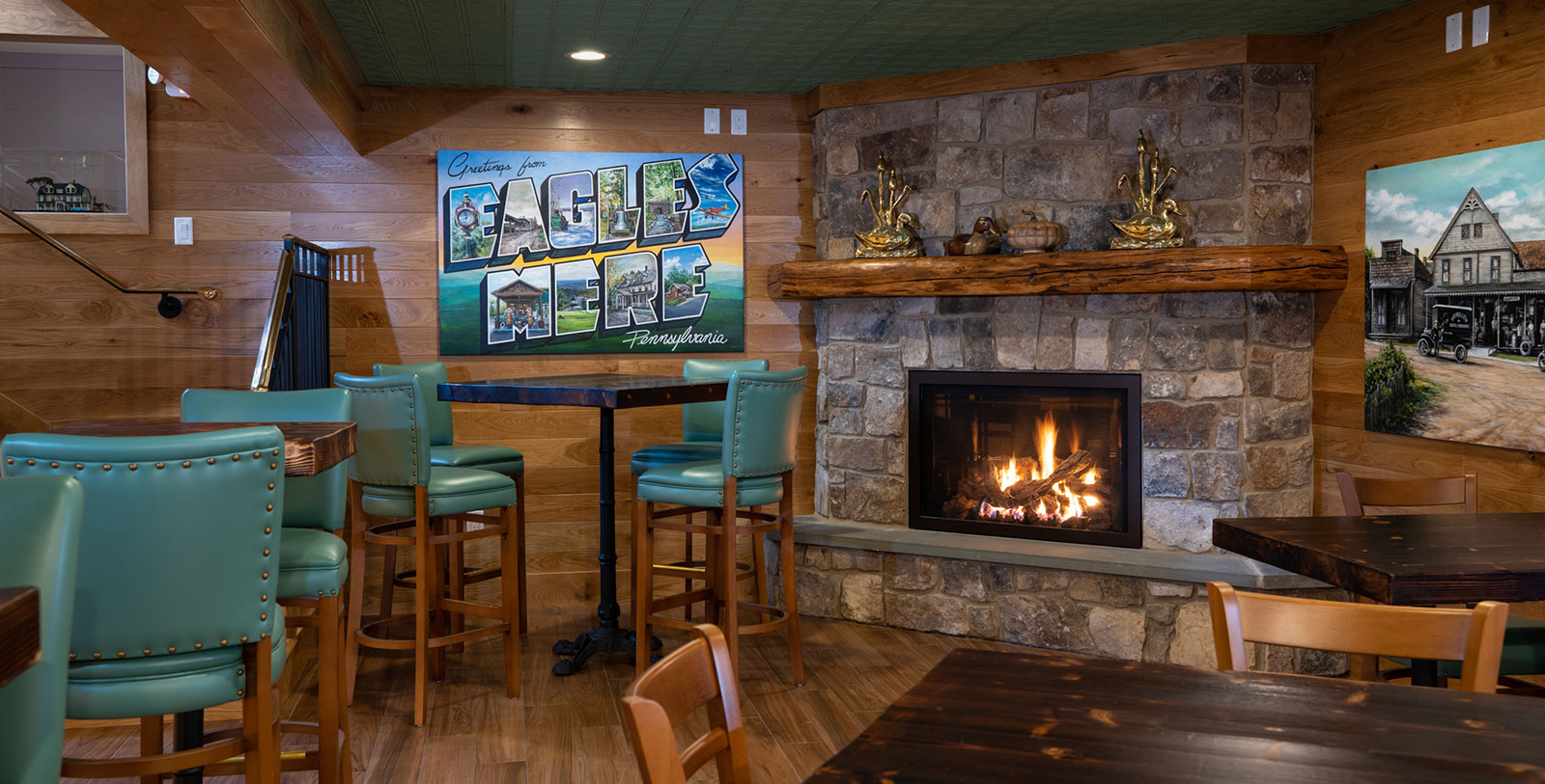 a fireplace with a table and chairs