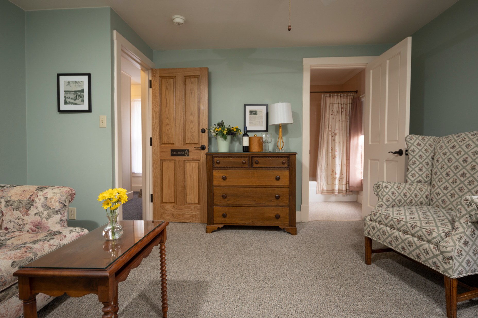 a room with a dresser and chair