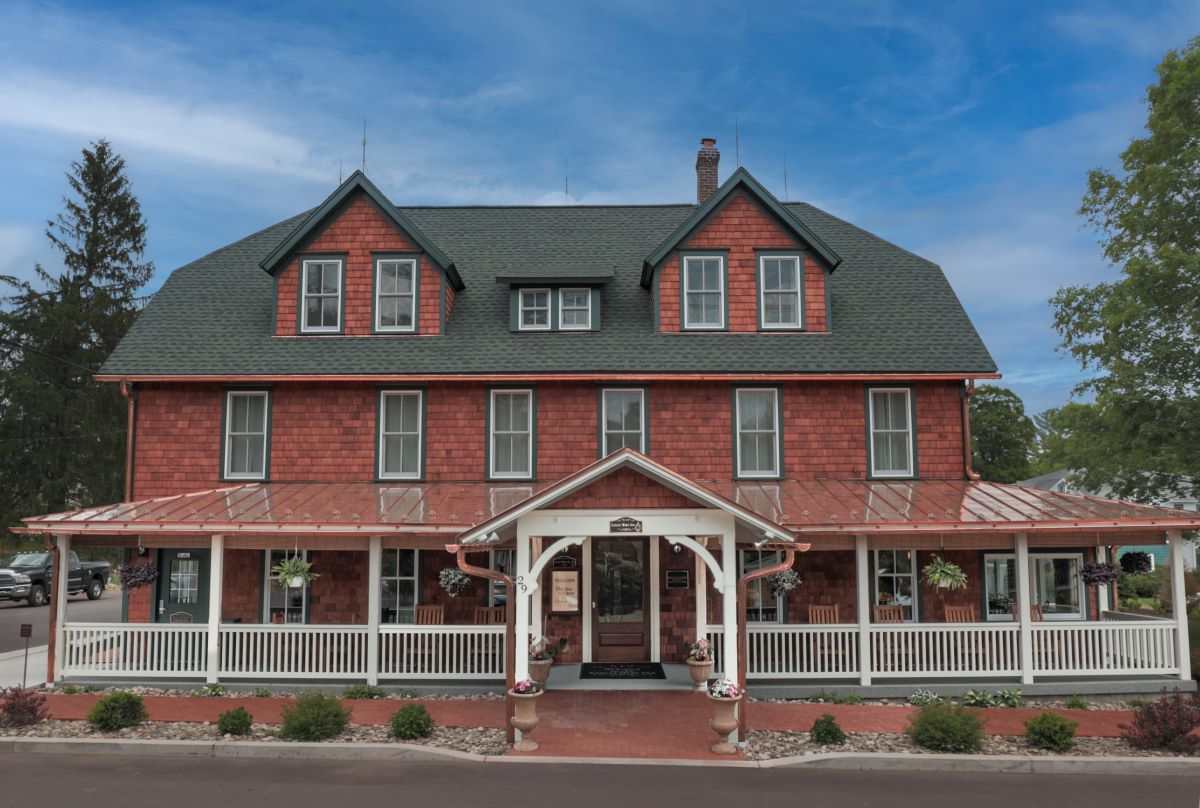 a large red house with a white porch