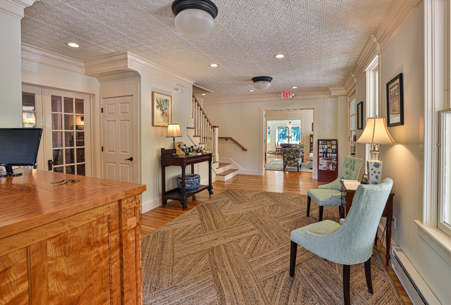 a room with a staircase and chairs