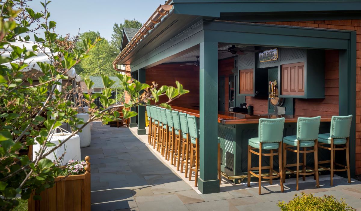 a bar with chairs and a row of chairs