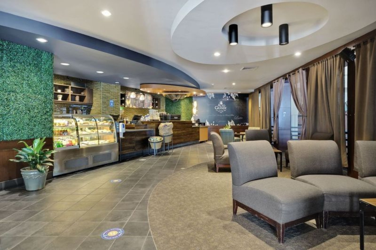 a room with chairs and a display case