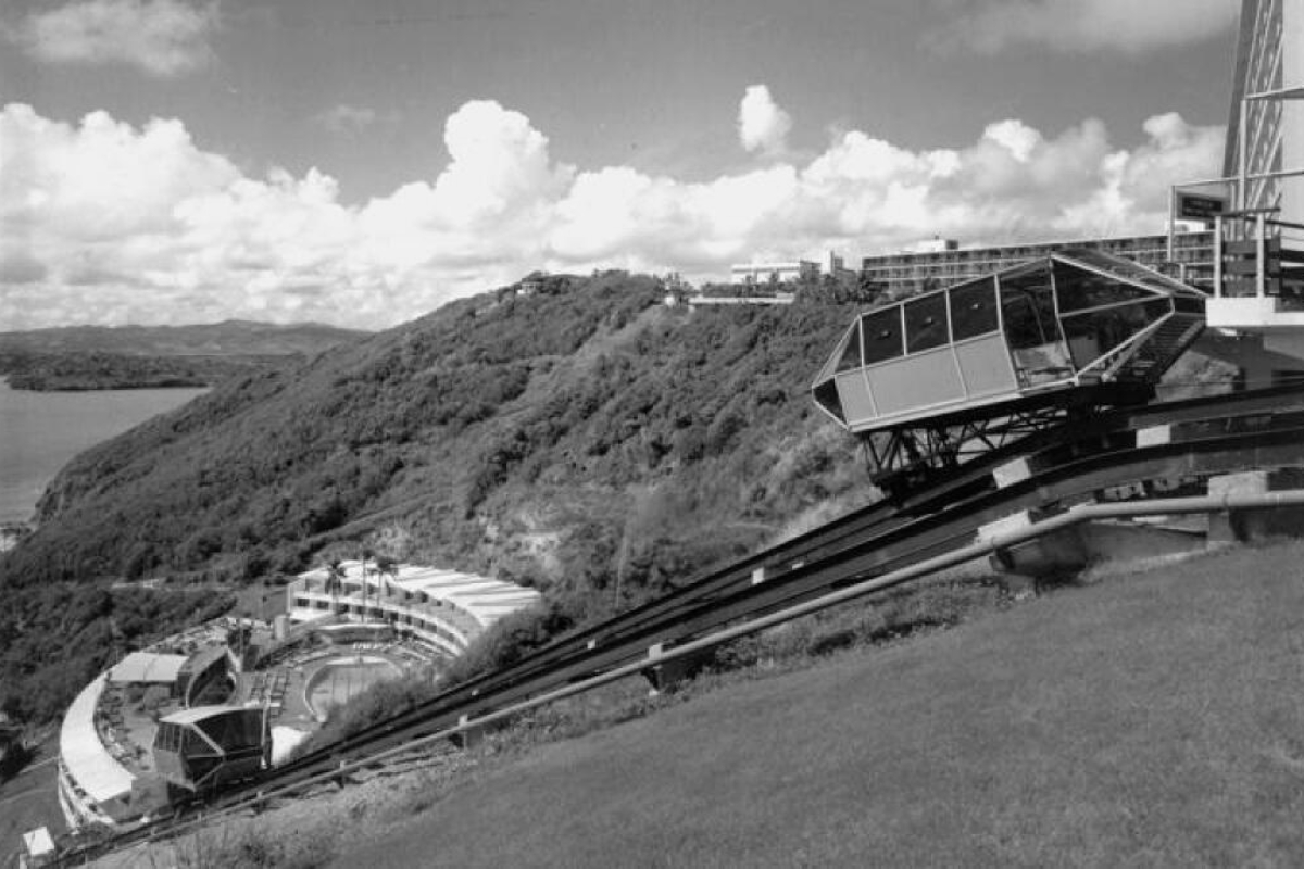 a black and white photo of a ski lift