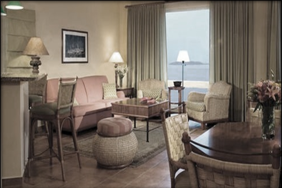 a living room with a couch and chairs