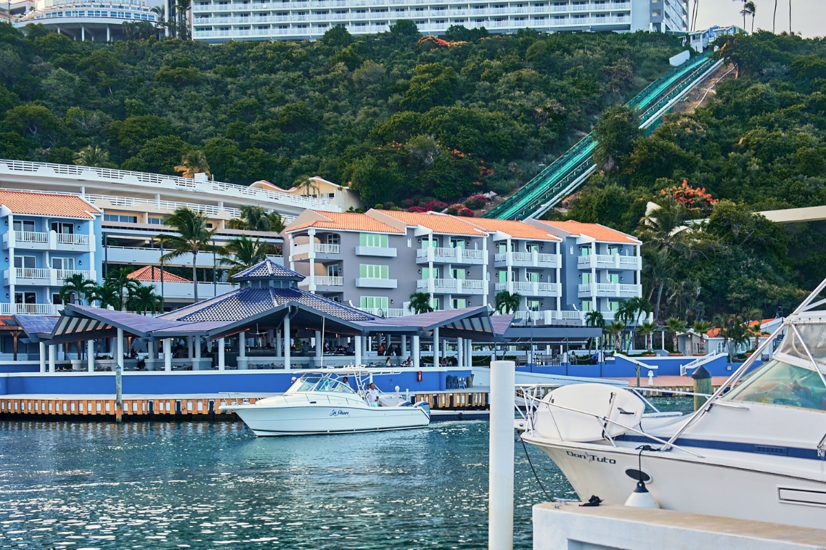 a water with boats and buildings in the background