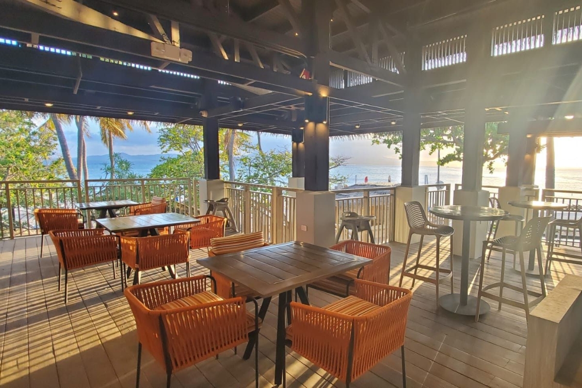 a patio with tables and chairs