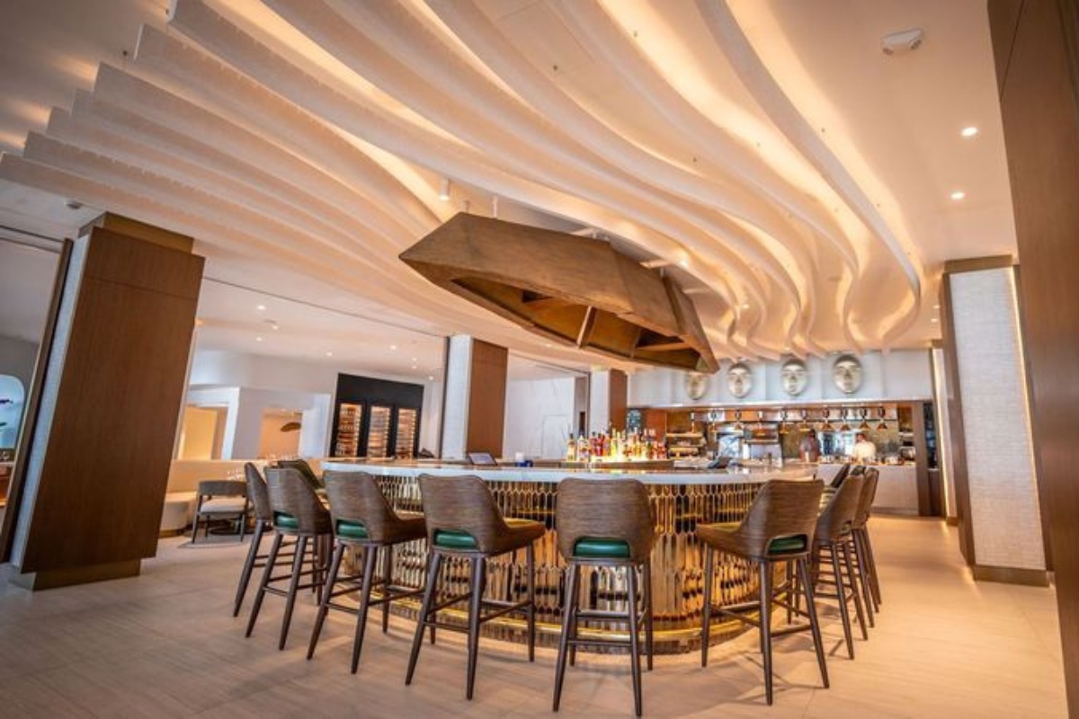 a bar with a round table and chairs