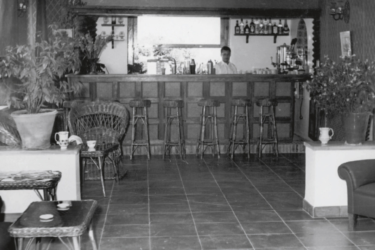 a man behind a bar