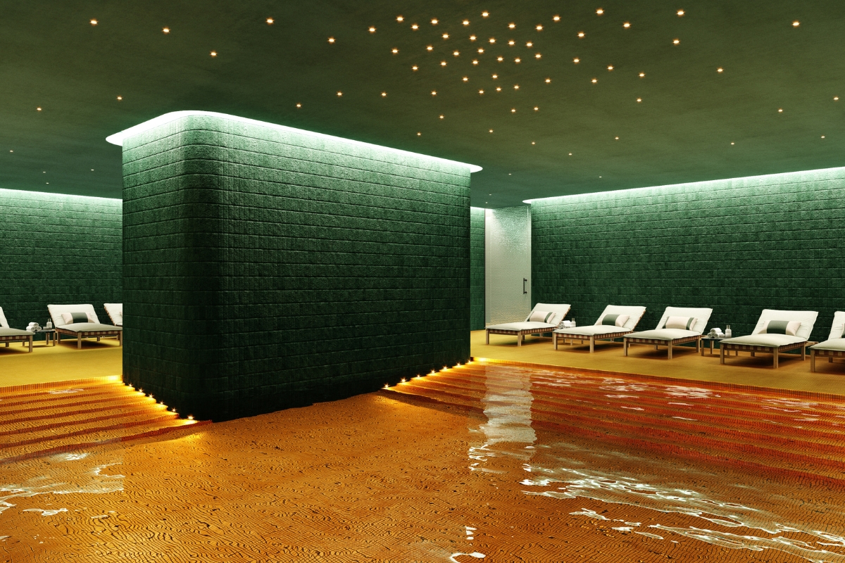 a room with a pool and chairs