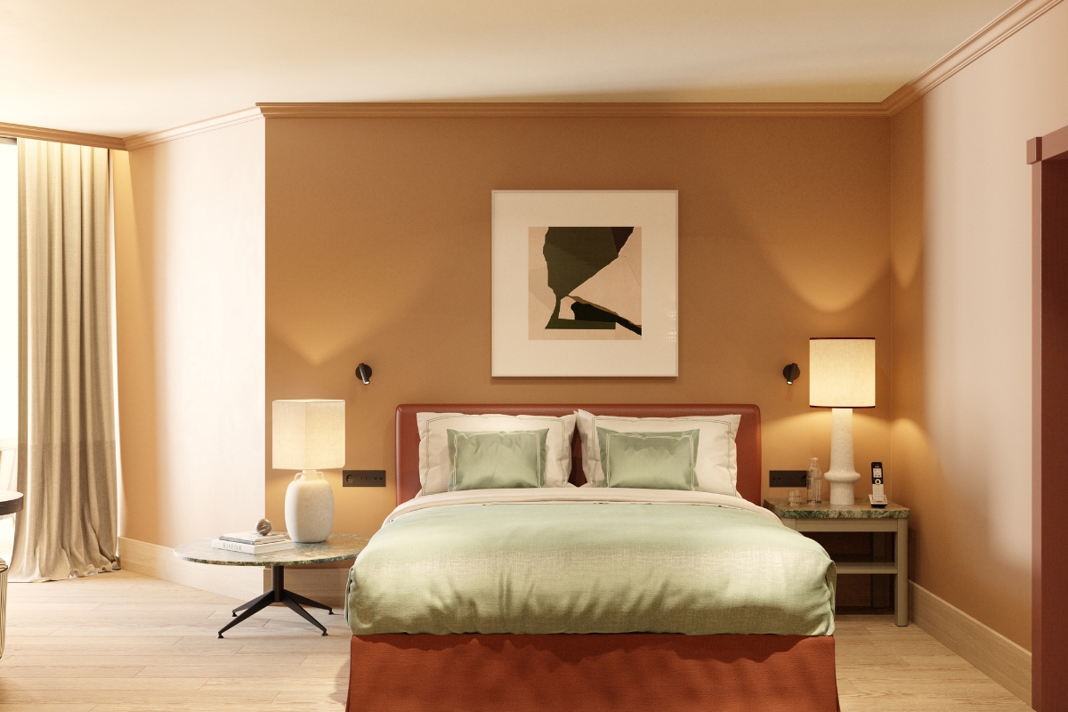 a bed with a lamp and a table