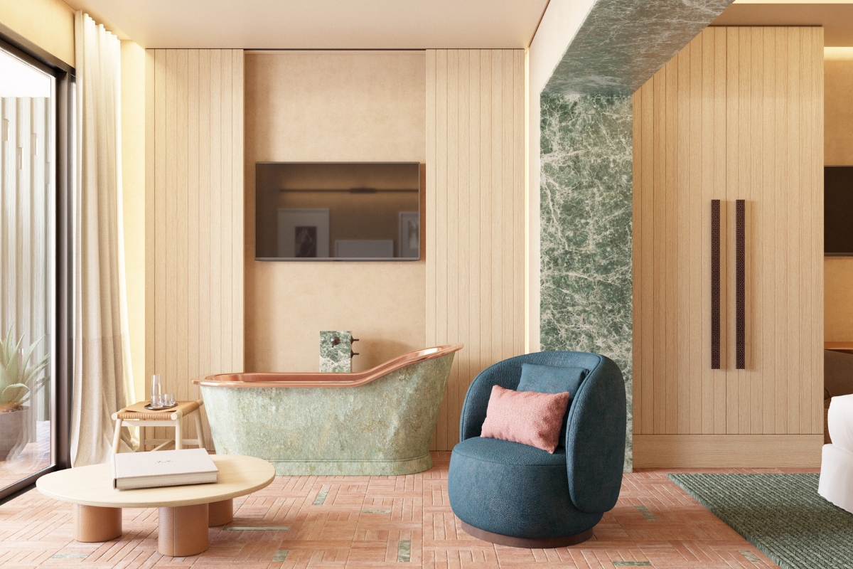 a bathroom with a tub and a blue chair