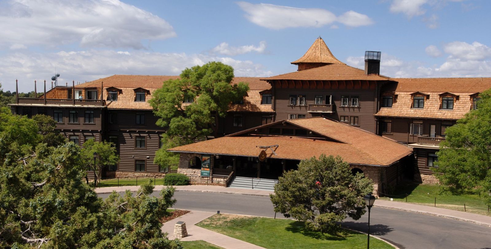 a building with a roof and a tree