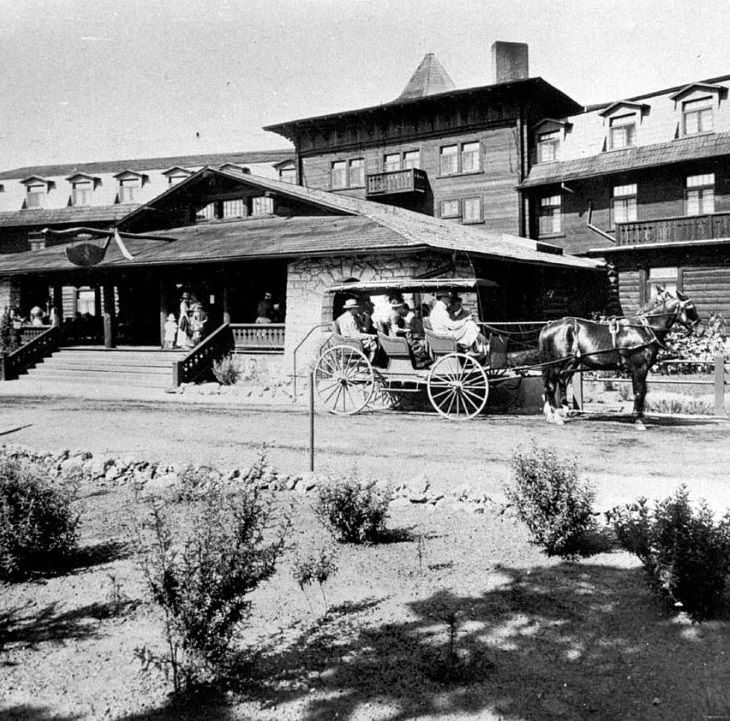 a horse drawn carriage in front of a building