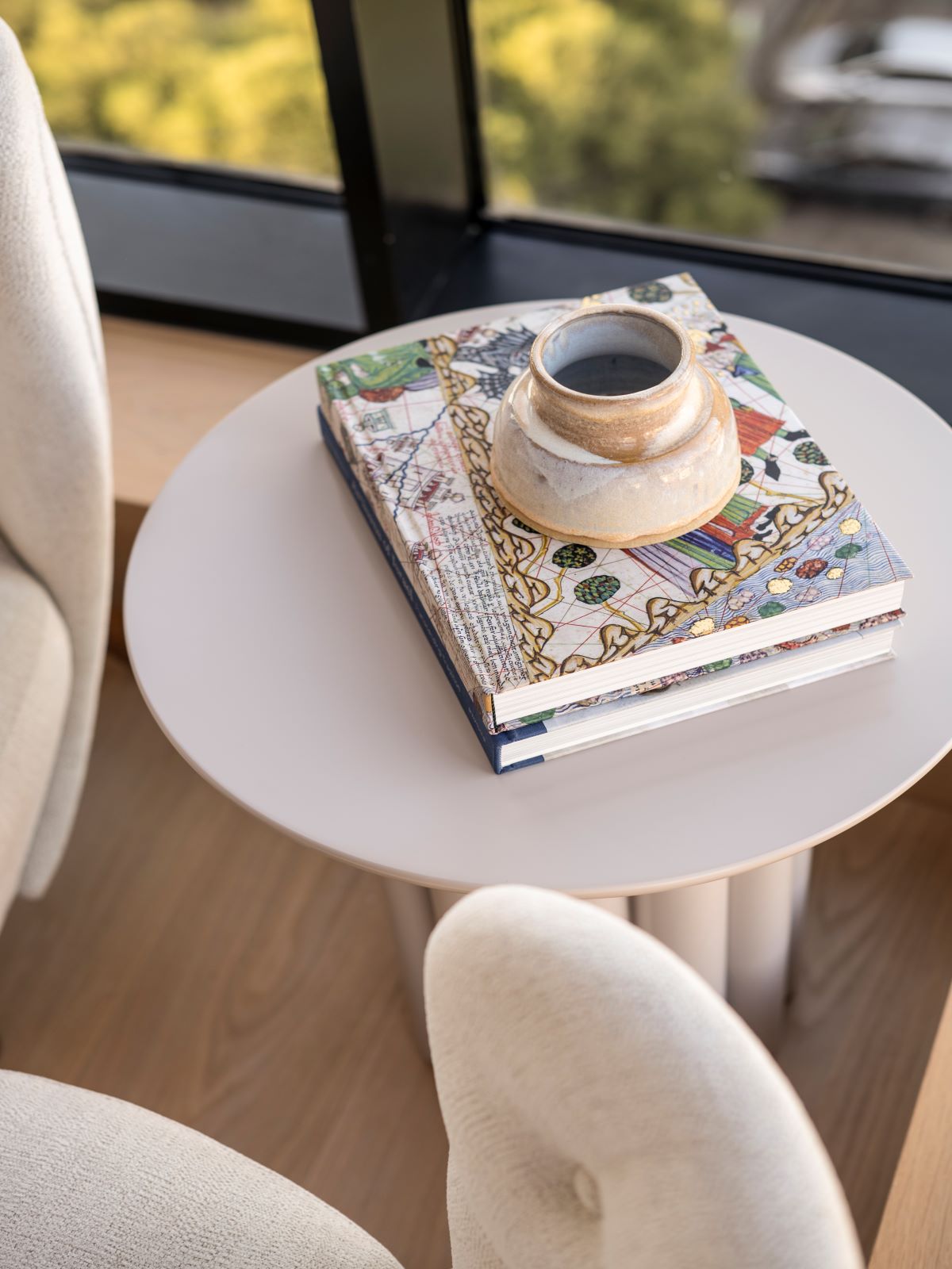 a book and a cup on a table