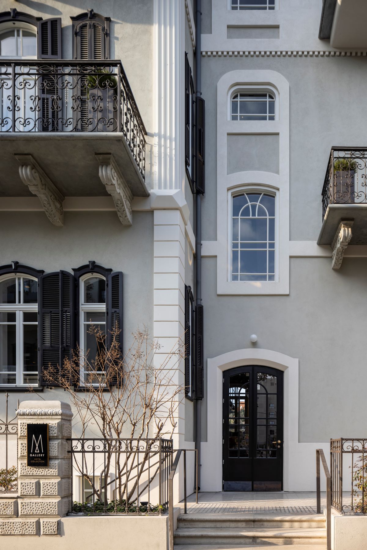a building with a gate and windows