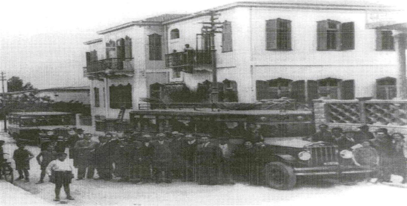 a group of people standing in front of a building