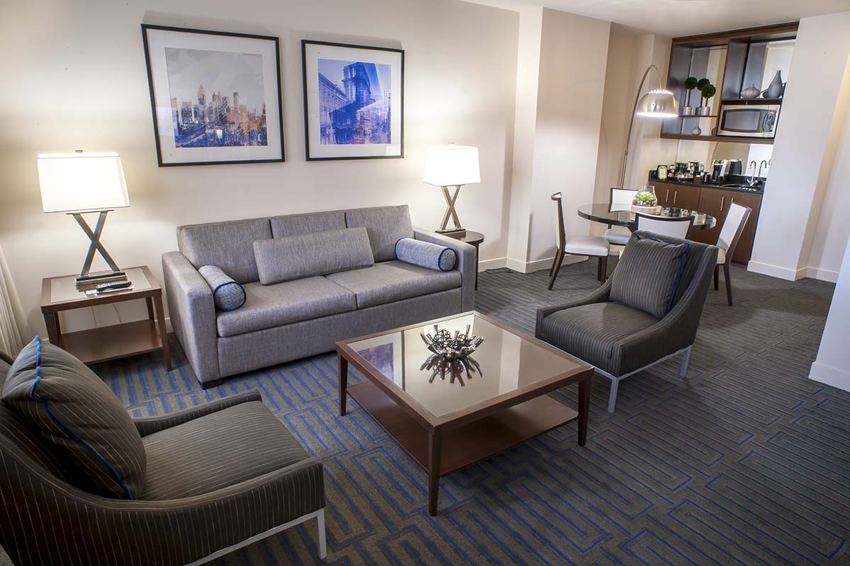 a living room with a couch and chairs