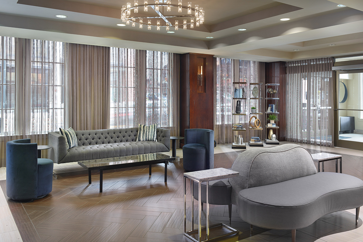 a room with couches and a chandelier