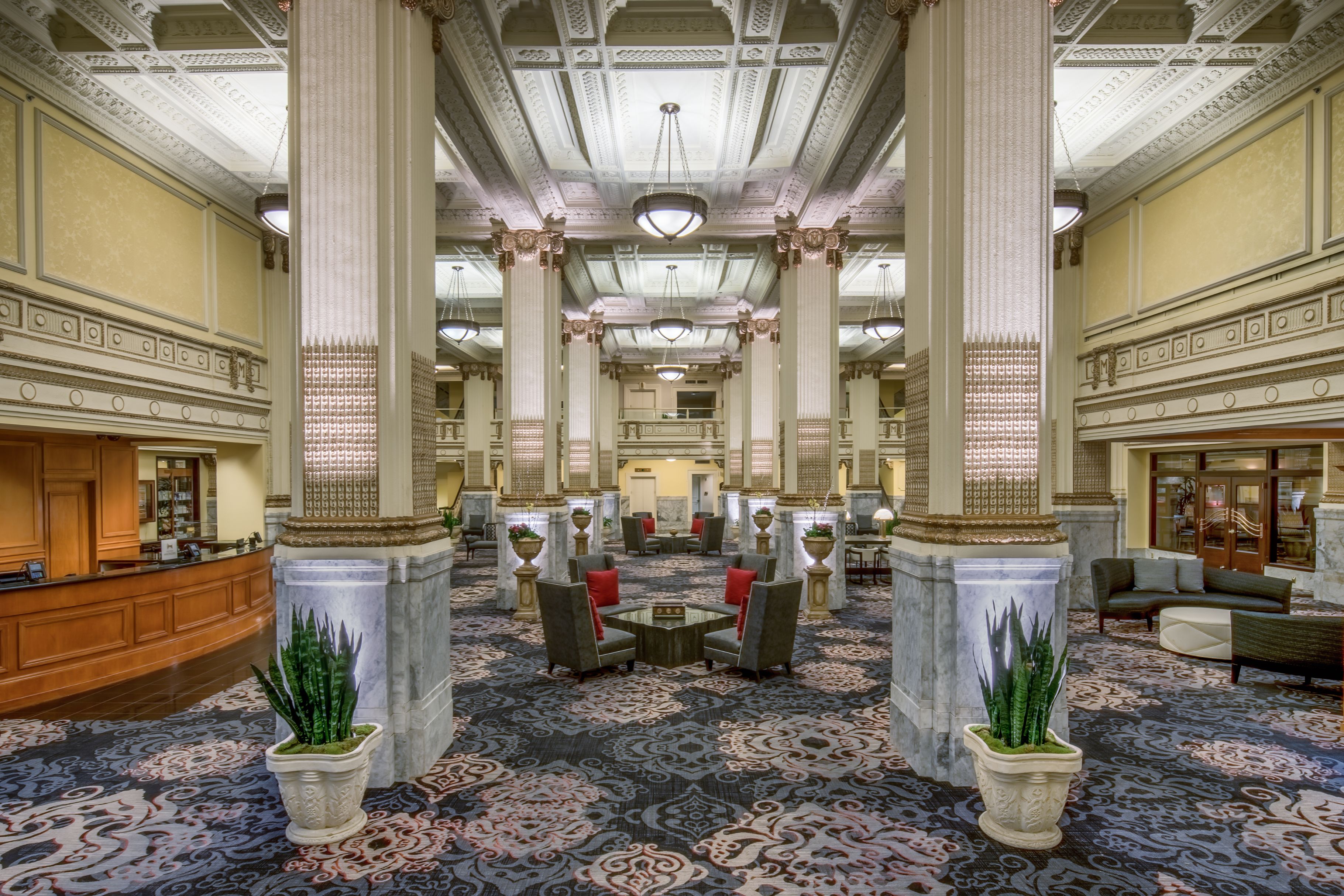 a large room with columns and chairs