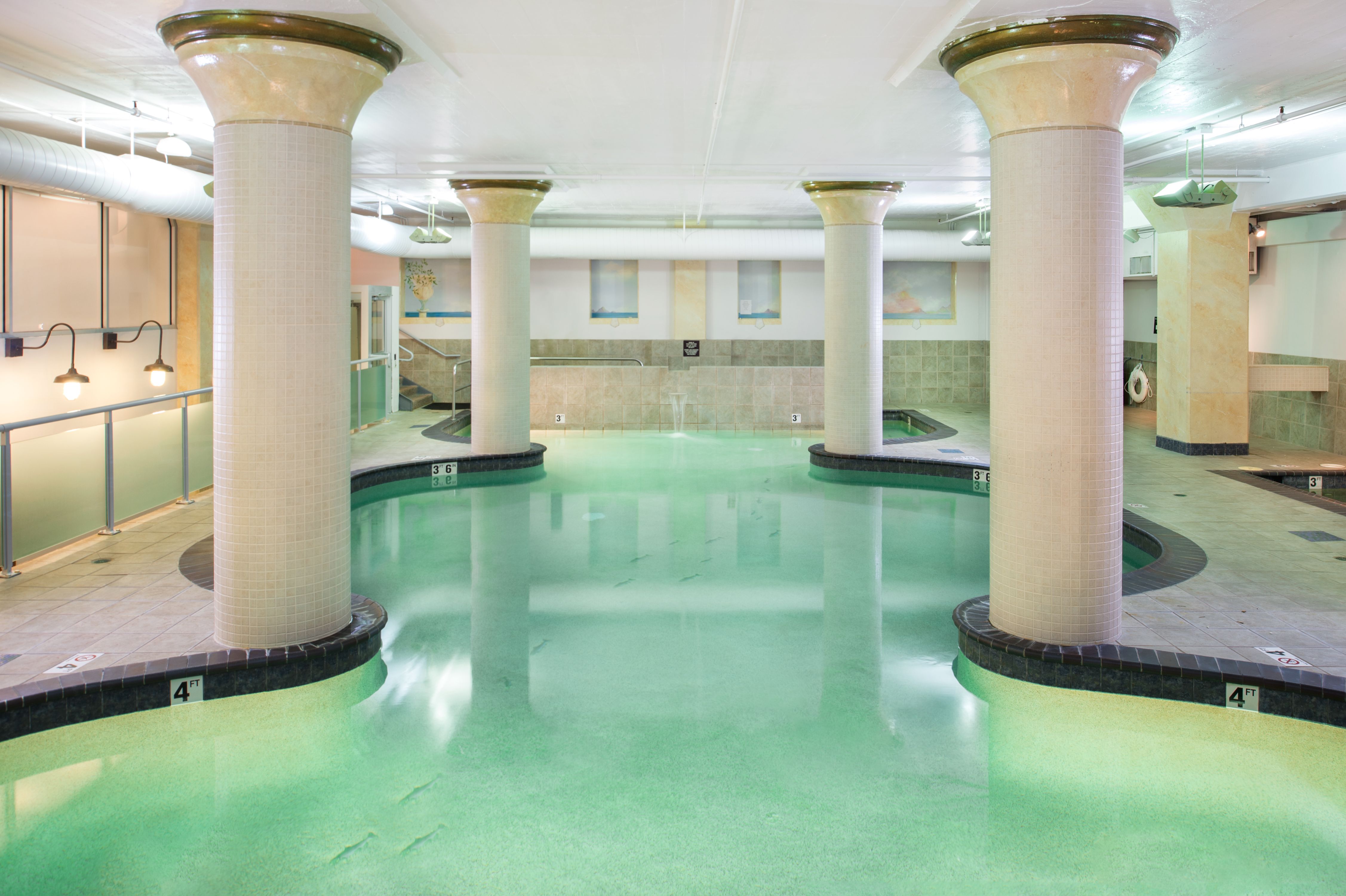 a pool with columns and a pool