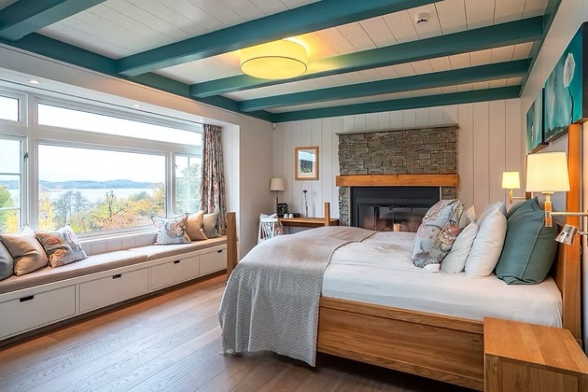 a room with a fireplace and a bed